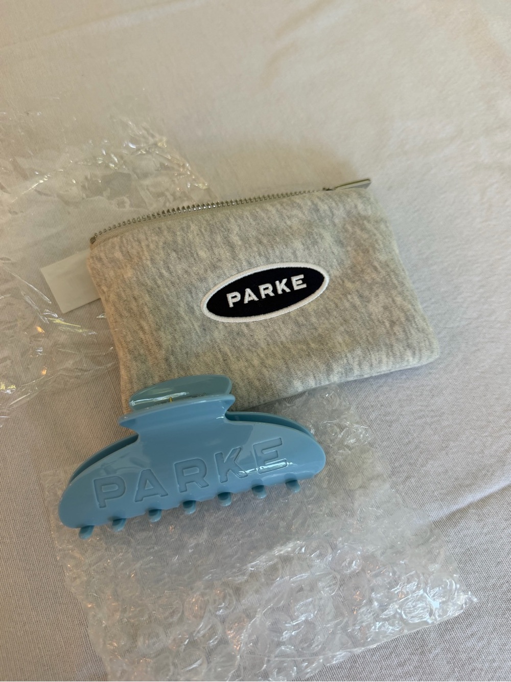PARKE Blue Hair Clip with logo Pouch